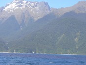 Still signs of snow in December on slopes overlooking Milford Sound